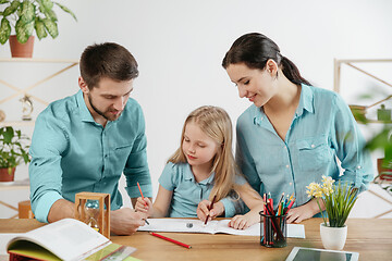 Image showing Young happy family are spending time together. A day in lovely home.