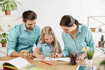 Image showing Young happy family are spending time together. A day in lovely home.