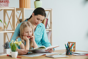 Image showing Young happy family are spending time together. A day with loved ones at home.