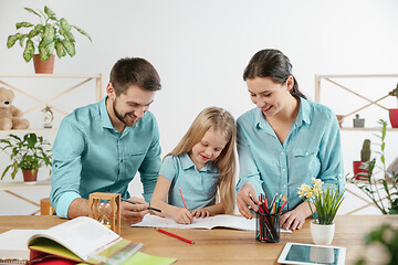 Image showing Young happy family are spending time together. A day in lovely home.