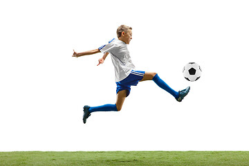 Image showing Young boy with soccer ball isolated on white. football player