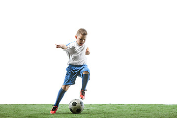 Image showing Young boy with soccer ball isolated on white. football player