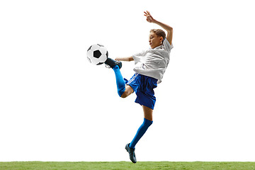 Image showing Young boy with soccer ball isolated on white. football player