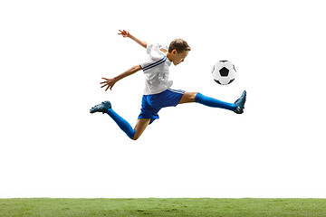 Image showing Young boy with soccer ball isolated on white. football player