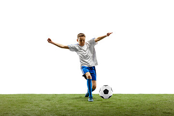 Image showing Young boy with soccer ball isolated on white. football player