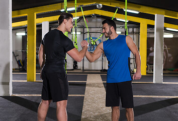 Image showing young men making high five