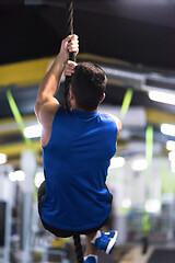 Image showing man doing rope climbing