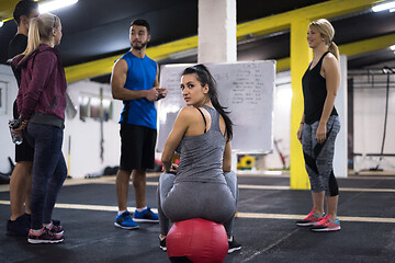 Image showing athletes getting instructions from trainer