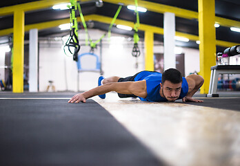 Image showing Young  man doing pushups