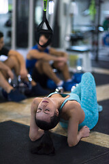 Image showing young athlete woman lying on the floor and relaxing