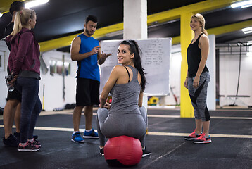 Image showing athletes getting instructions from trainer