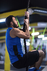 Image showing man doing rope climbing