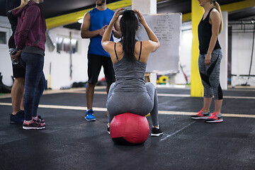 Image showing athletes getting instructions from trainer