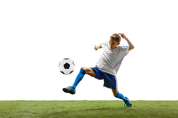 Image showing Young boy with soccer ball isolated on white. football player