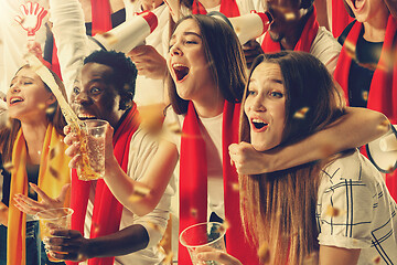 Image showing Group of happy fans are cheering for their team victory.