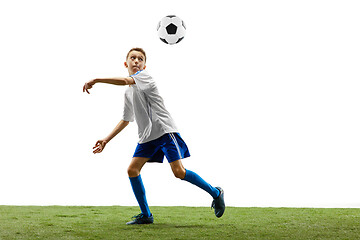 Image showing Young boy with soccer ball isolated on white. football player