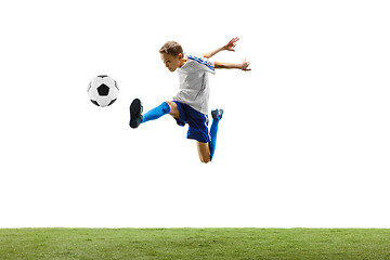 Image showing Young boy with soccer ball isolated on white. football player