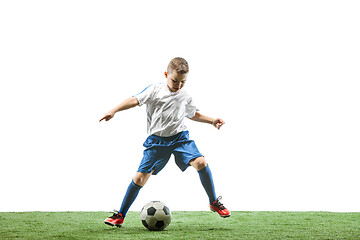 Image showing Young boy with soccer ball isolated on white. football player