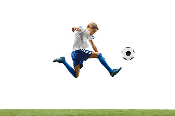 Image showing Young boy with soccer ball isolated on white. football player