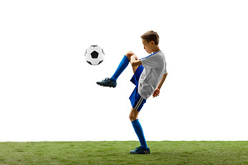 Image showing Young boy with soccer ball isolated on white. football player