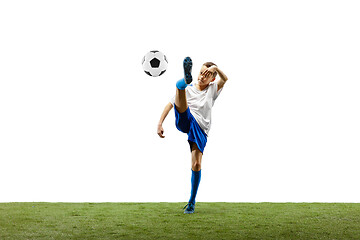 Image showing Young boy with soccer ball isolated on white. football player