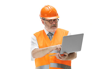 Image showing The builder in orange helmet isolated on white