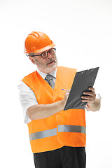 Image showing The builder in orange helmet isolated on white