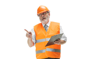 Image showing The builder in orange helmet isolated on white