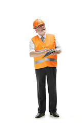 Image showing The builder in orange helmet isolated on white