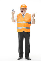 Image showing The builder in orange helmet isolated on white