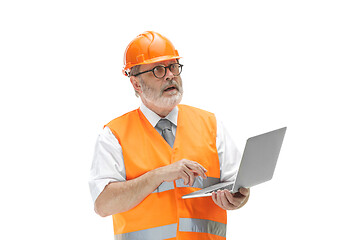 Image showing The builder in orange helmet isolated on white