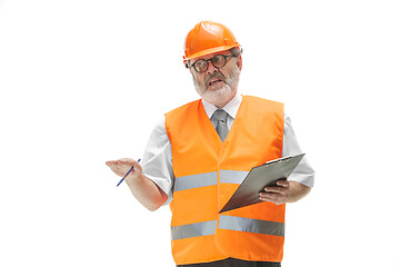 Image showing The builder in orange helmet isolated on white