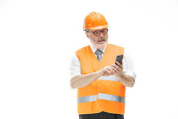 Image showing The builder in orange helmet isolated on white