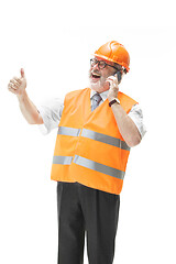 Image showing The builder in orange helmet isolated on white