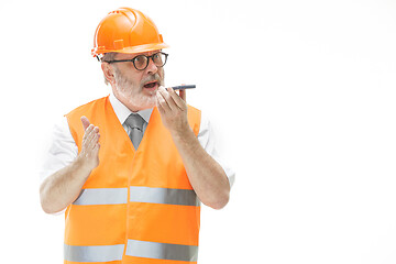 Image showing The builder in orange helmet isolated on white