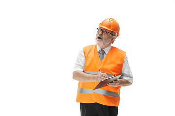 Image showing The builder in orange helmet isolated on white