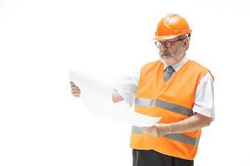 Image showing The builder in orange helmet isolated on white