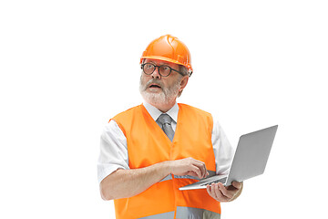 Image showing The builder in orange helmet isolated on white