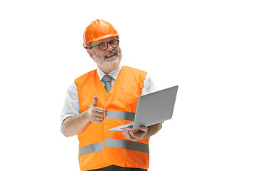 Image showing The builder in orange helmet isolated on white