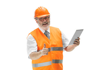 Image showing The builder in orange helmet isolated on white