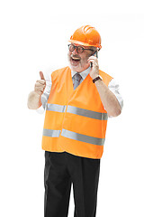 Image showing The builder in orange helmet isolated on white