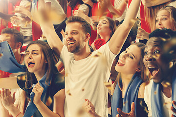 Image showing Group of happy fans are cheering for their team victory.