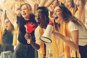 Image showing Group of happy fans are cheering for their team victory.