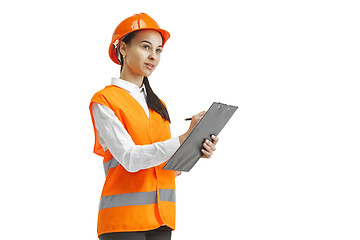 Image showing The female builder in orange helmet isolated on white