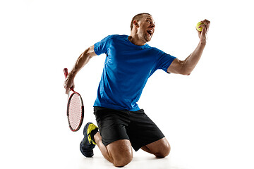 Image showing Portrait of a handsome male tennis player celebrating his success isolated on a white background