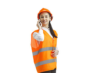 Image showing The female builder in orange helmet isolated on white