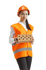 Image showing The female builder in orange helmet isolated on white