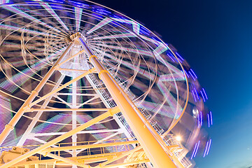 Image showing Ferris wheel moving at night