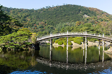 Image showing Japanese Ritsurin Garden and wooden bridge