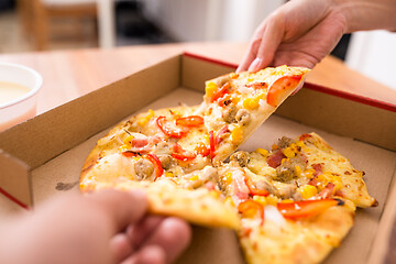 Image showing Eating pizza at home